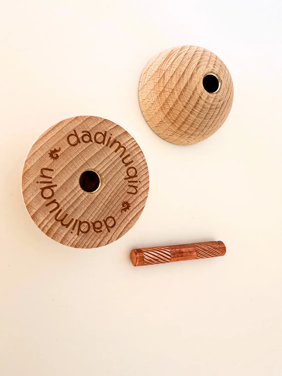 One engraved beech wood half and the fluted pure copper core, seen from above